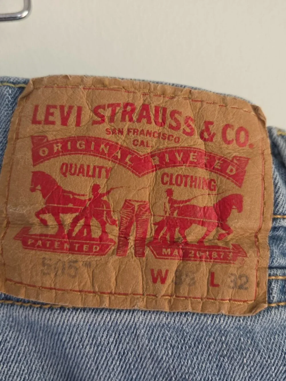 Levi’s 505 men’s regular fit straight leg jeans in a light blue wash